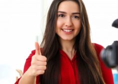 https://jobinvi.com/wp-content/uploads/2021/07/young-beautiful-smiling-brunette-woman-in-red-shirt-sitting-in-office-opposite-camera-on-tripod-and-showing-good-luck-thumb-finger-up-scaled-e1707785963870-236x168.jpg